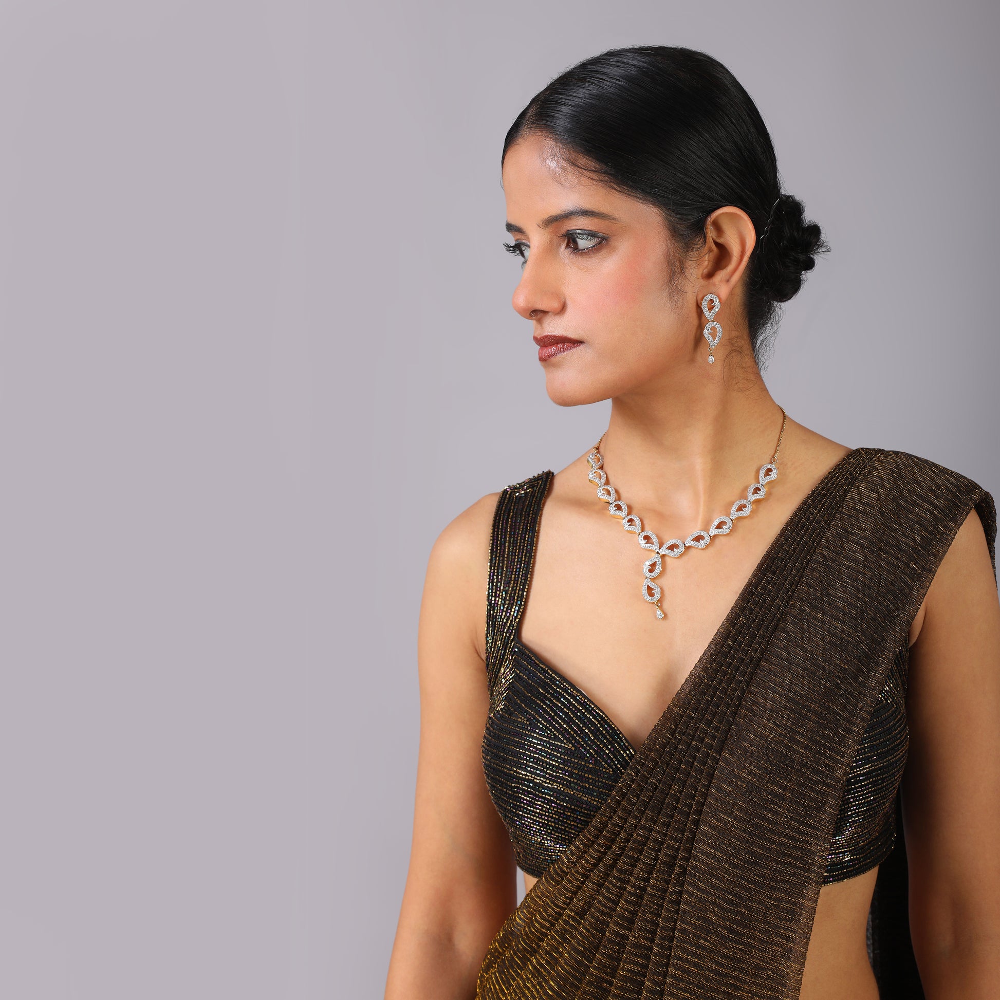 Shimmering Bronze Metallic Pre-Draped Saree with Geometric Hand-Embroidered Blouse