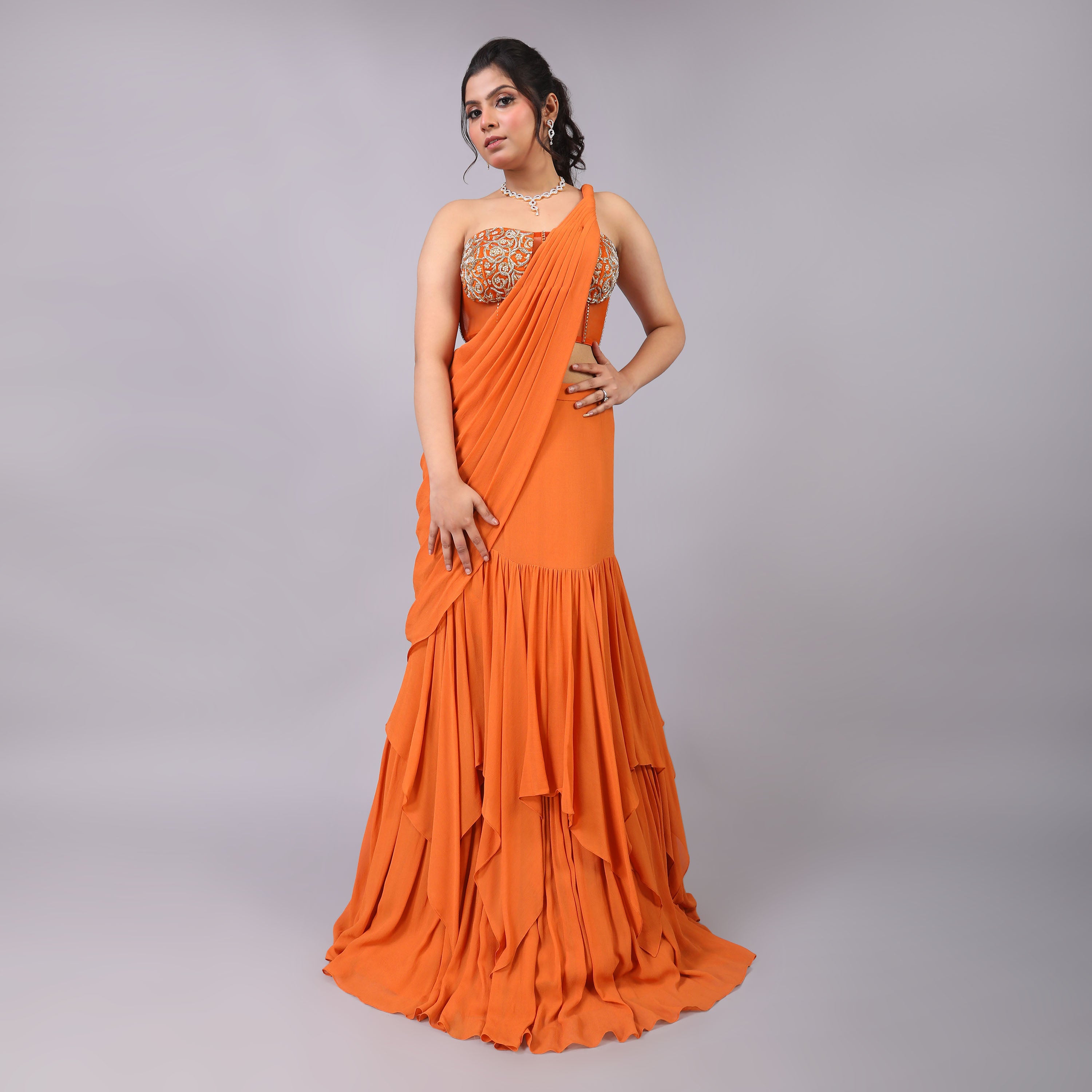 Stunning Rust-Orange Georgette Ruffled Pre-Draped Saree with Dabka Work Corset Blouse