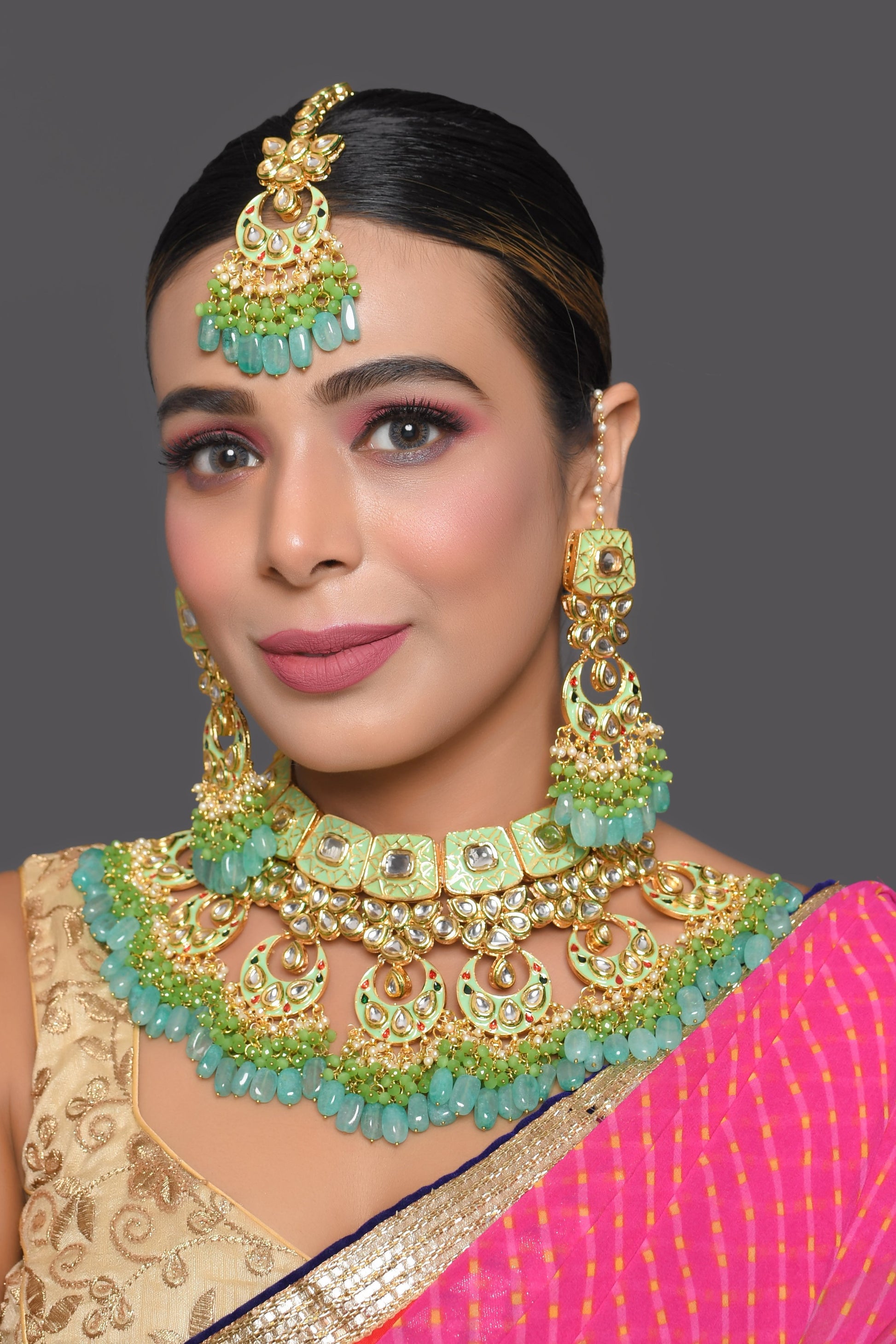 Green enameled Kundan Maharani Necklace and earrings with Maang Tikka