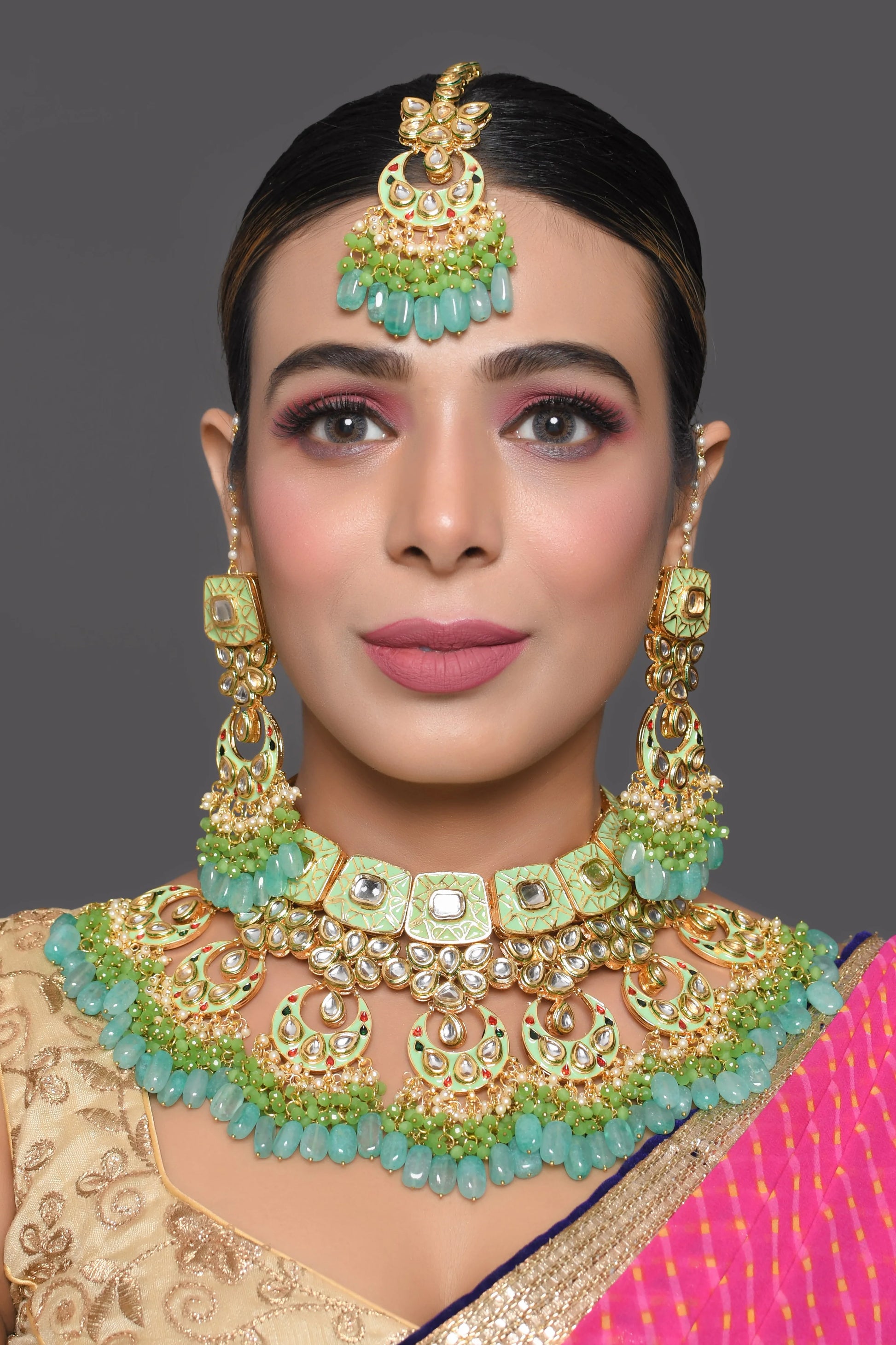 Green enameled Kundan Maharani Necklace and earrings with Maang Tikka