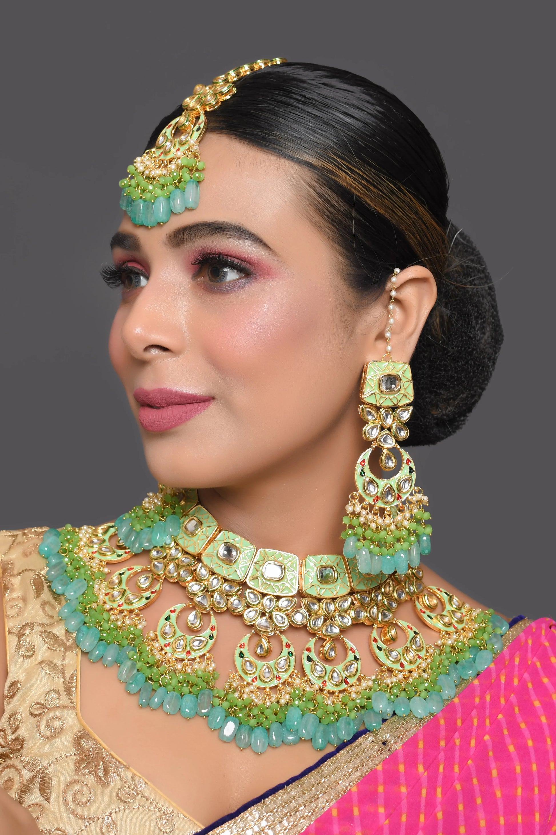 Green enameled Kundan Maharani Necklace and earrings with Maang Tikka