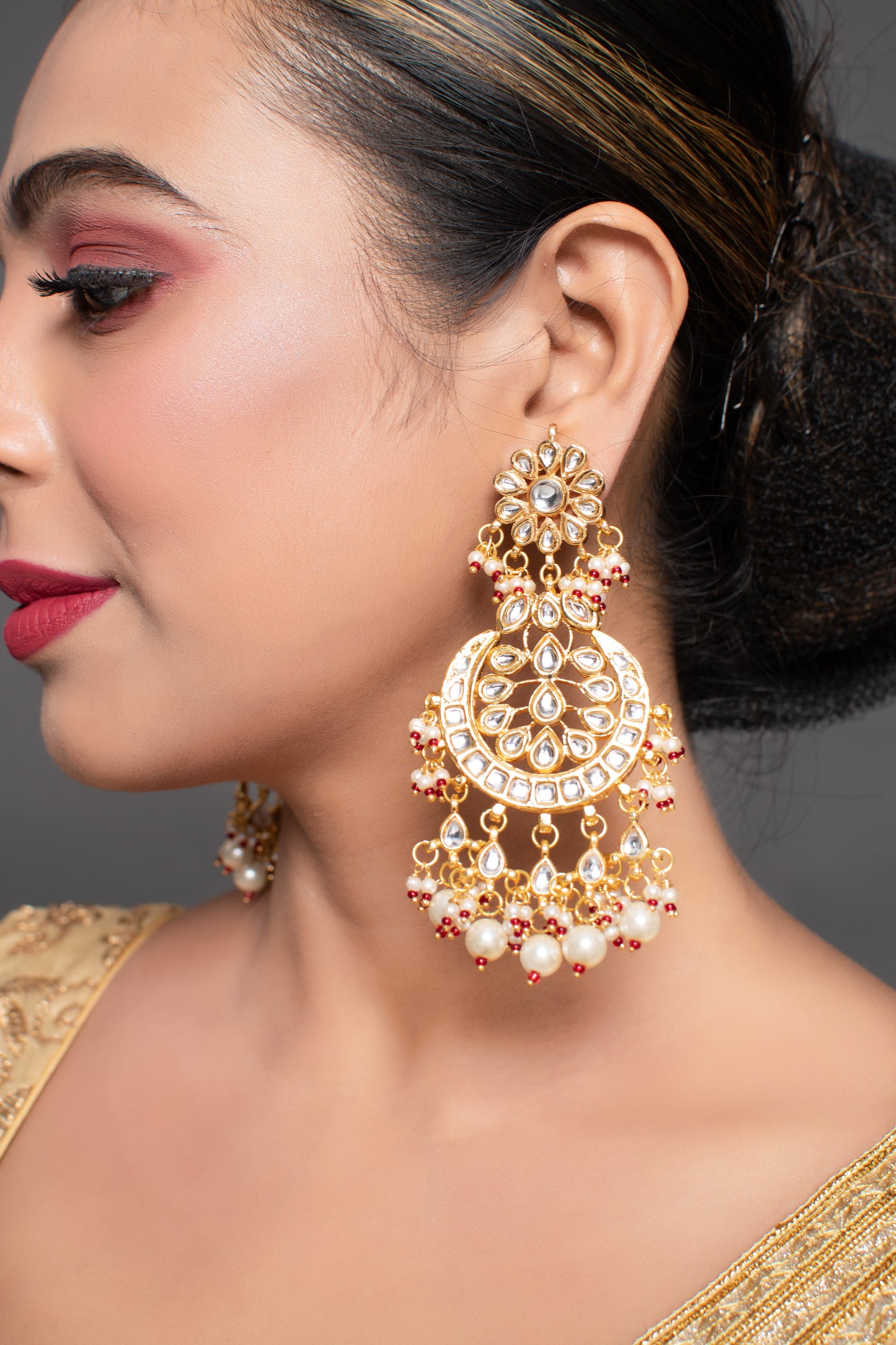 Gold toned Kundan Crescent Shaped earring