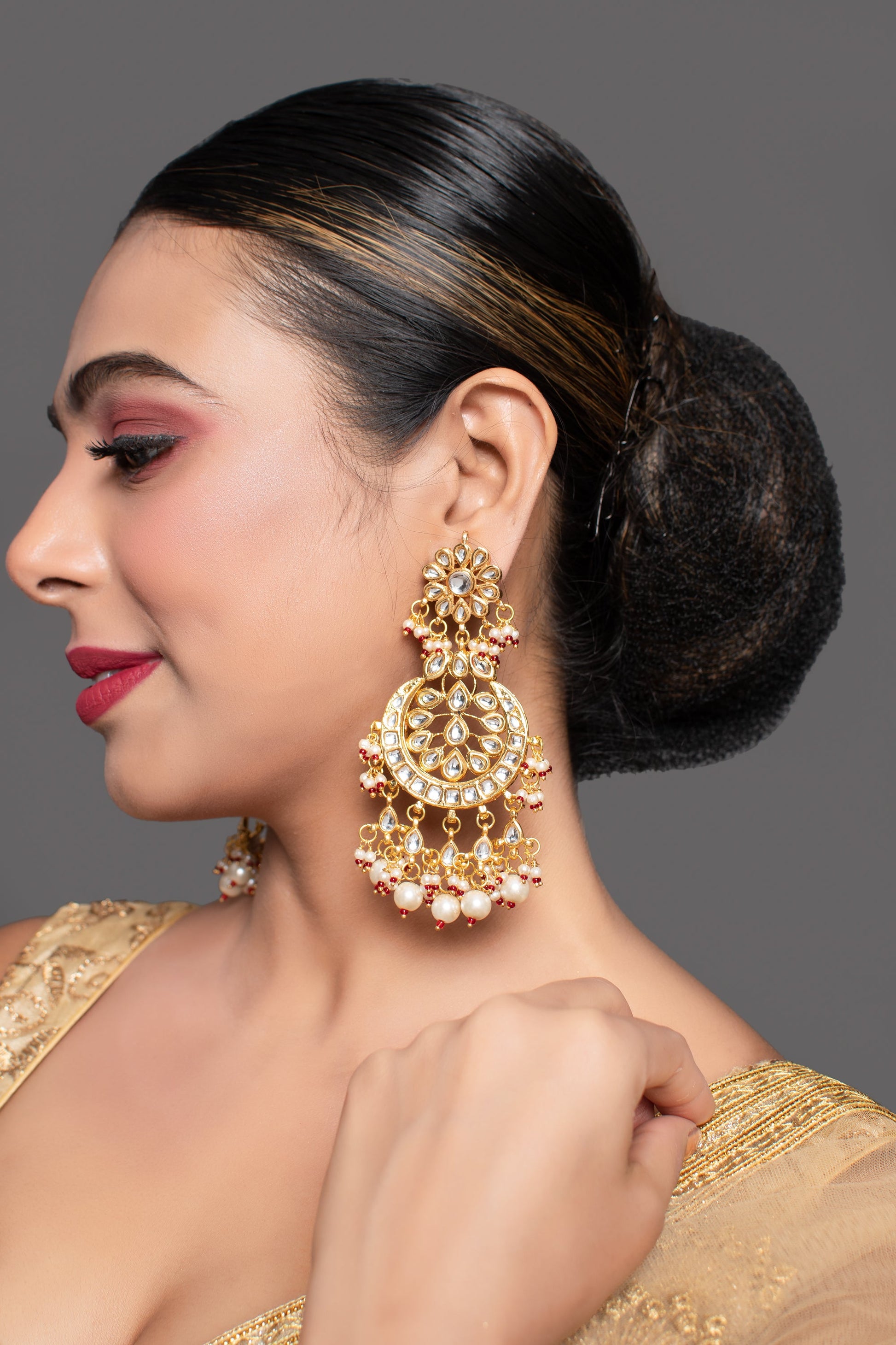 Gold toned Kundan Crescent Shaped earring