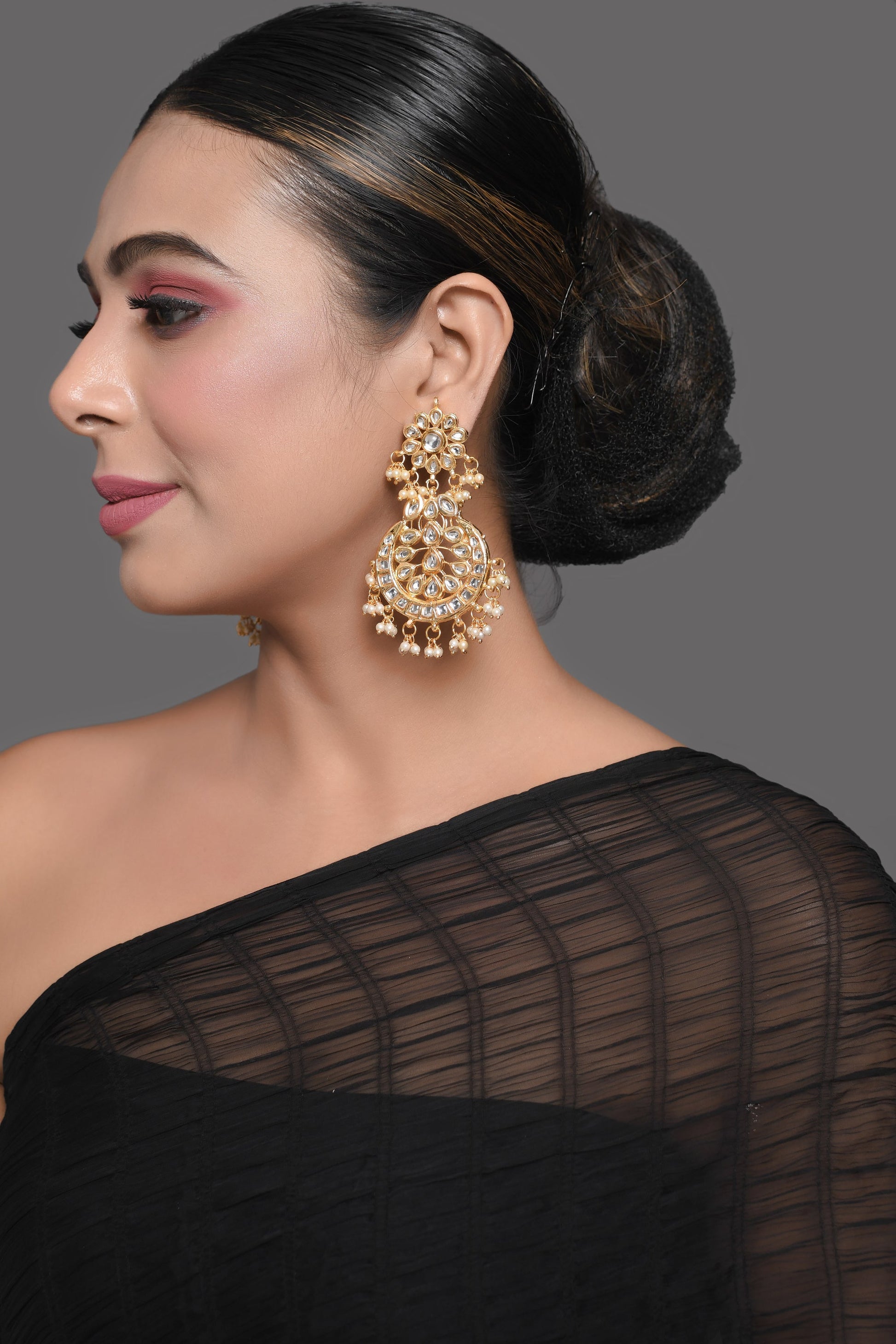 Gold toned Kundan Crescent Shaped earring