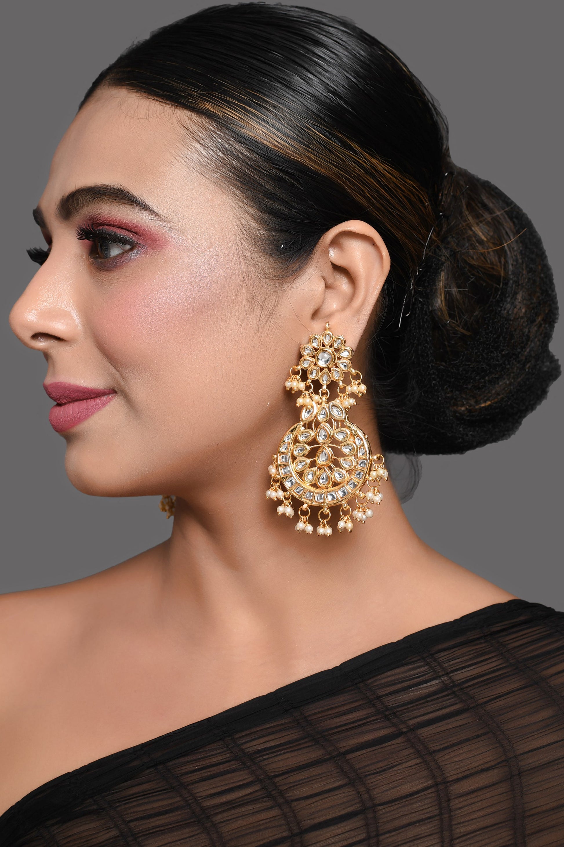 Gold toned Kundan Crescent Shaped earring