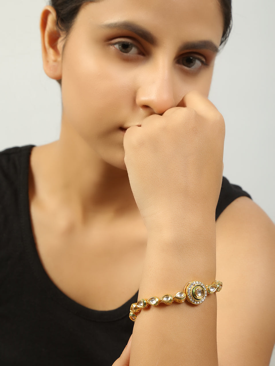 Gold toned kundan inspired bracelet with pearls