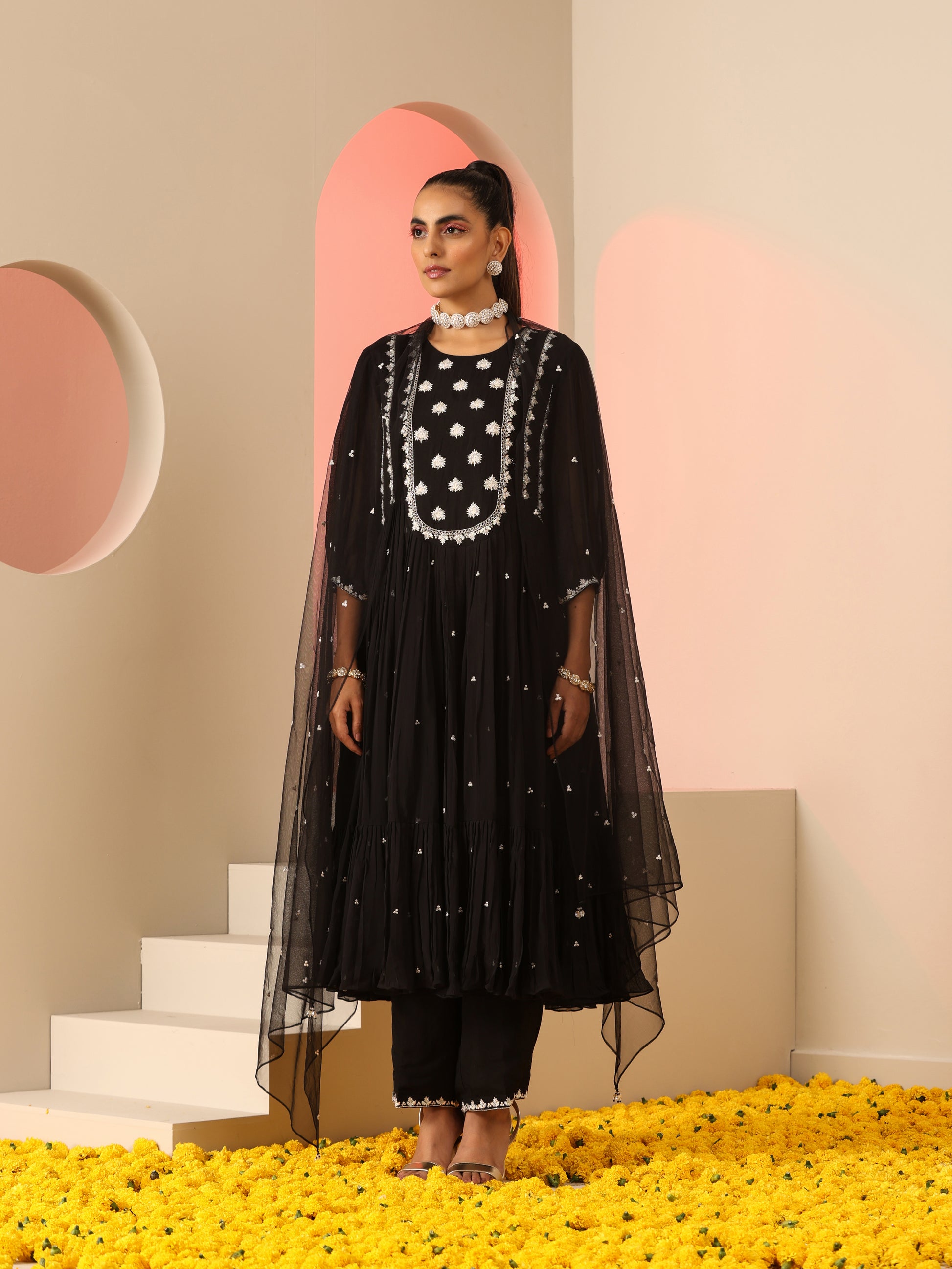 Black kurta set with white embroidery.