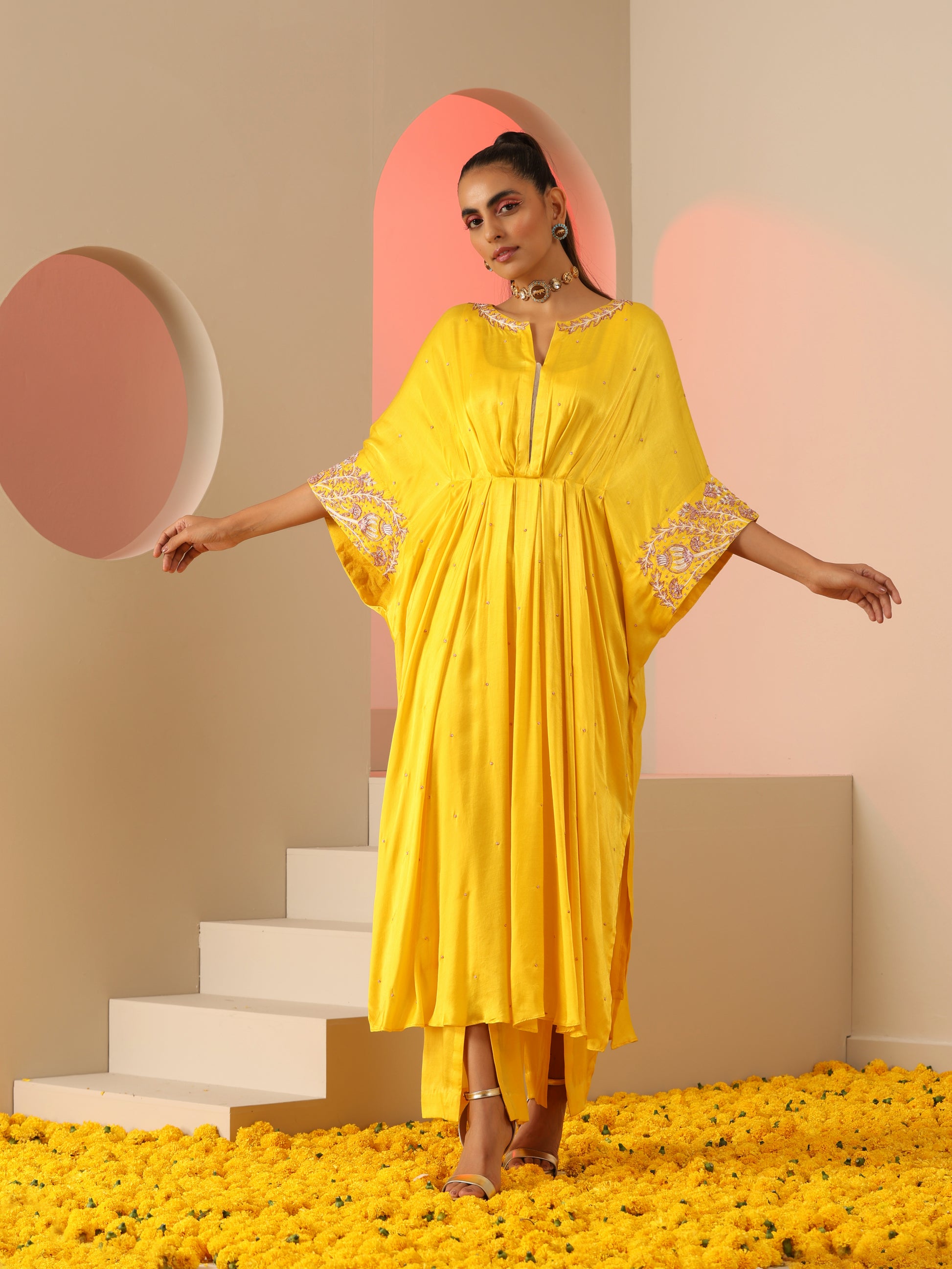 Yellow zardozi kaftan set with pants.