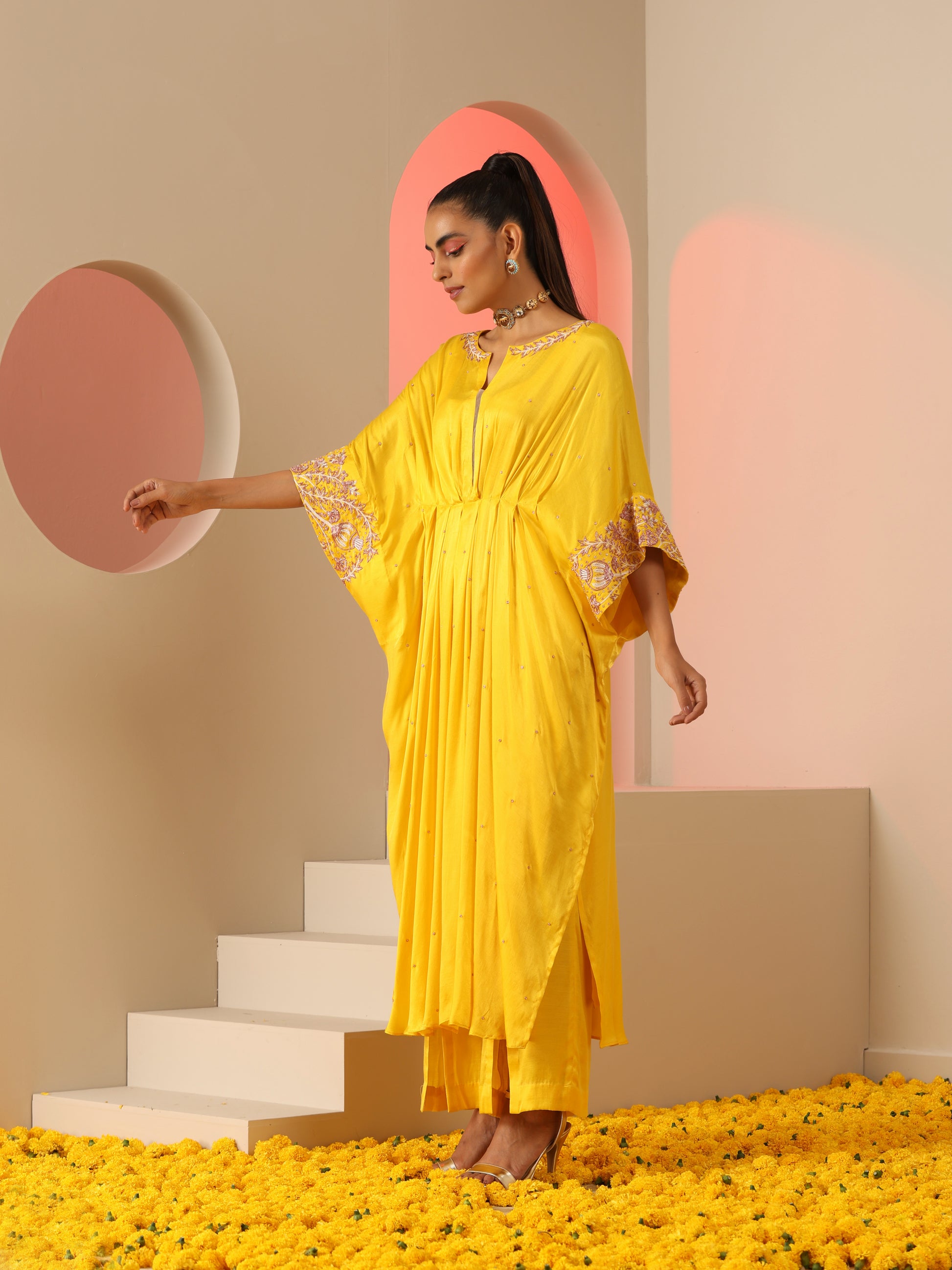 Yellow zardozi kaftan set with pants.