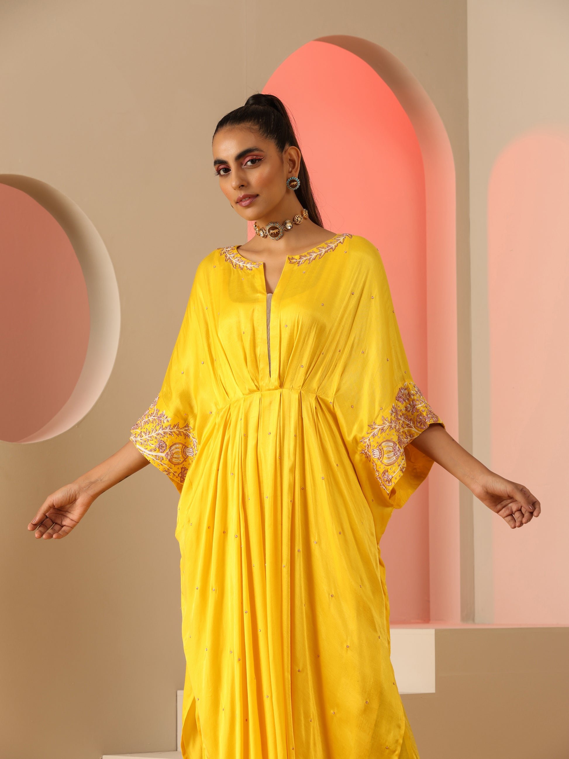 Yellow zardozi kaftan set with pants.