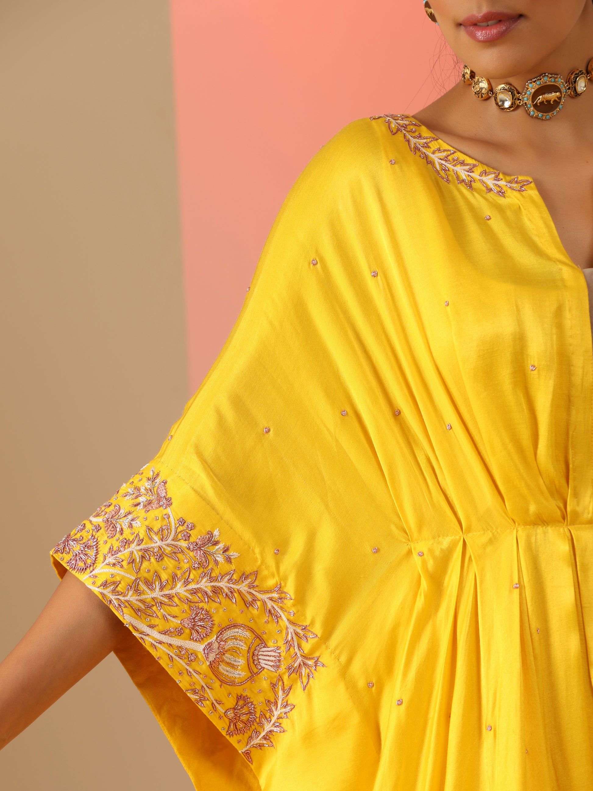 Yellow zardozi kaftan set with pants.