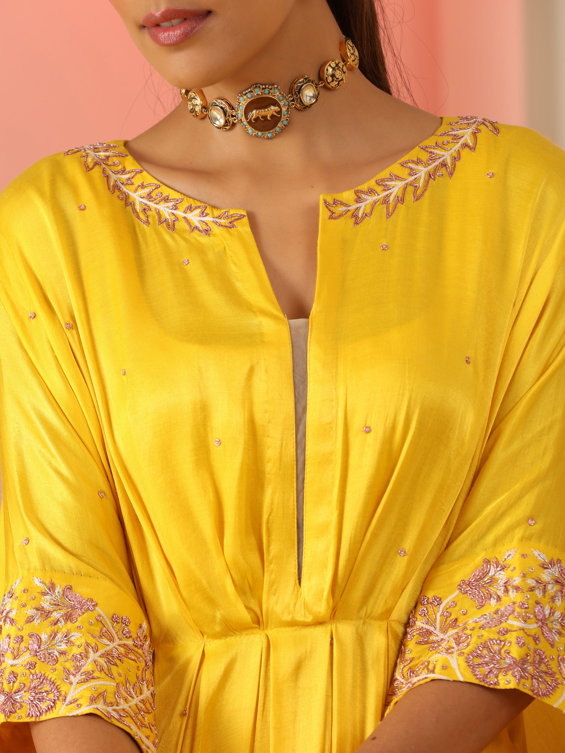 Yellow zardozi kaftan set with pants.