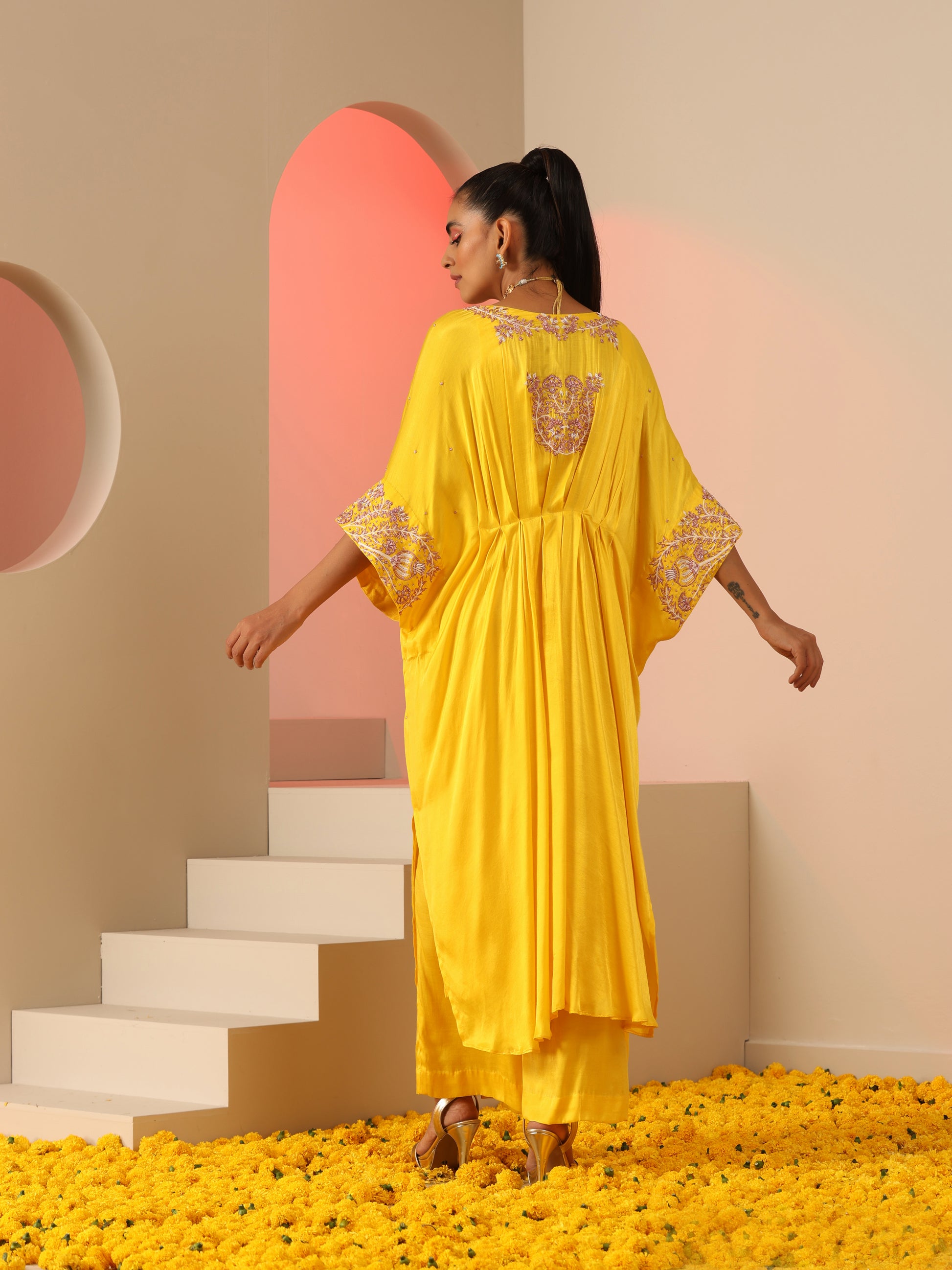 Yellow zardozi kaftan set with pants.