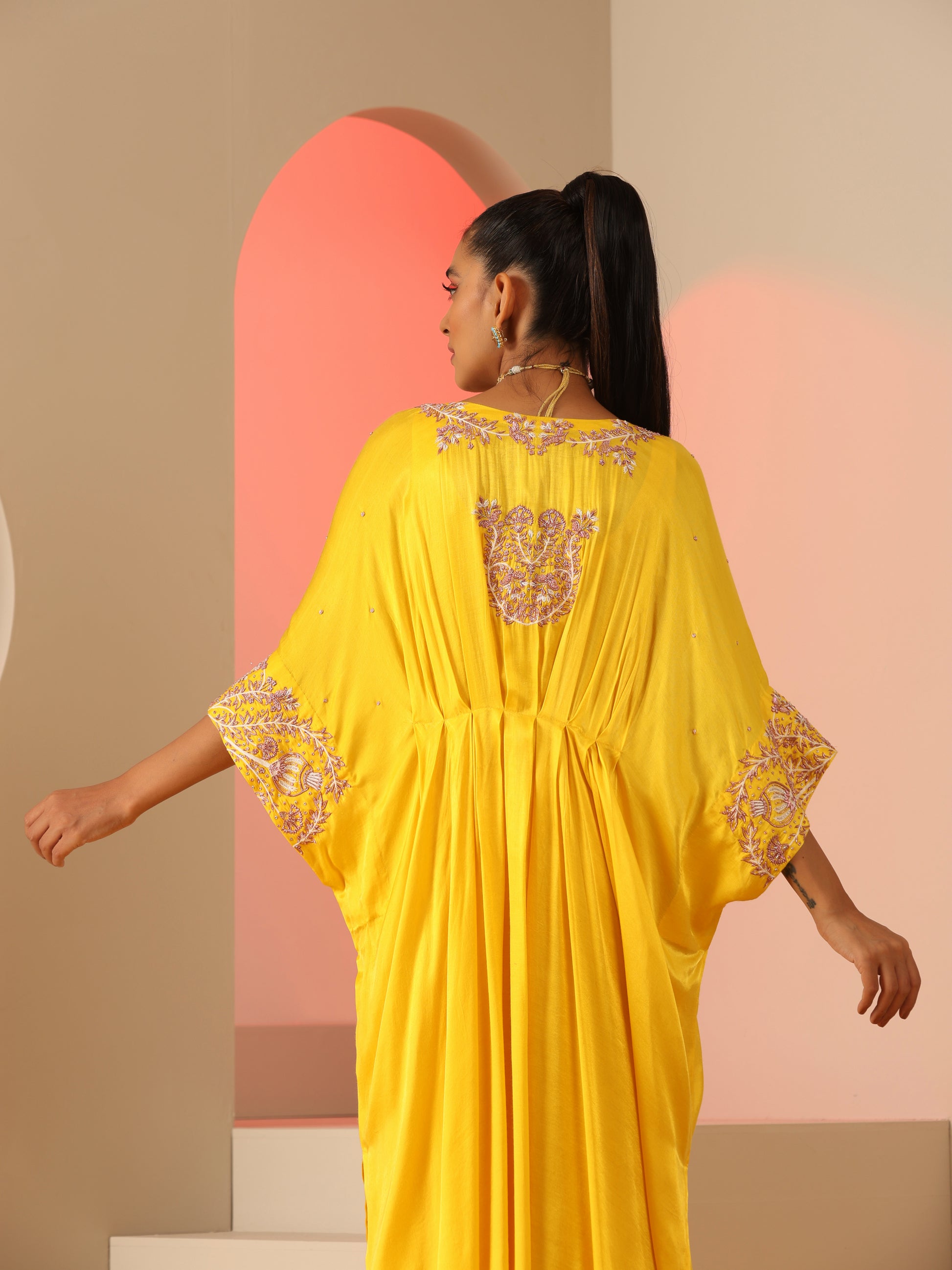 Yellow zardozi kaftan set with pants.