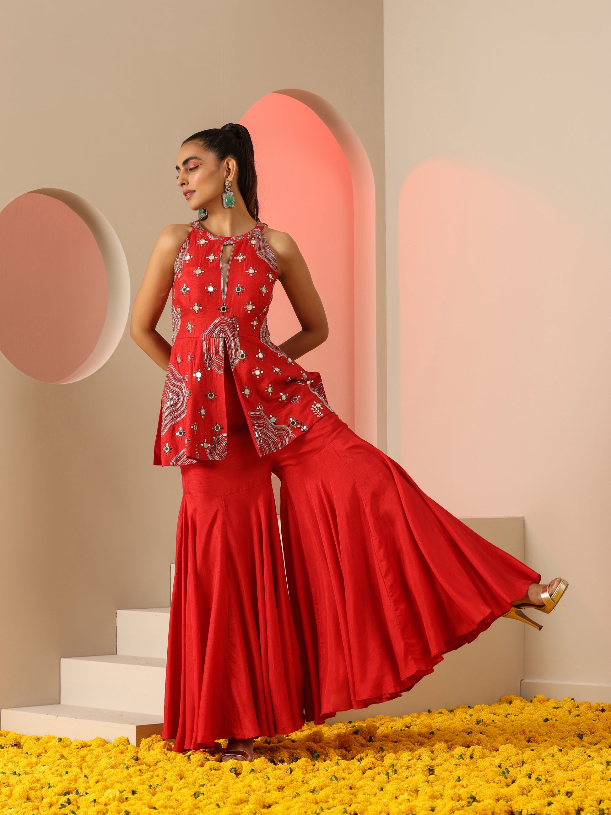 Red Zari and mirror work sharara set.