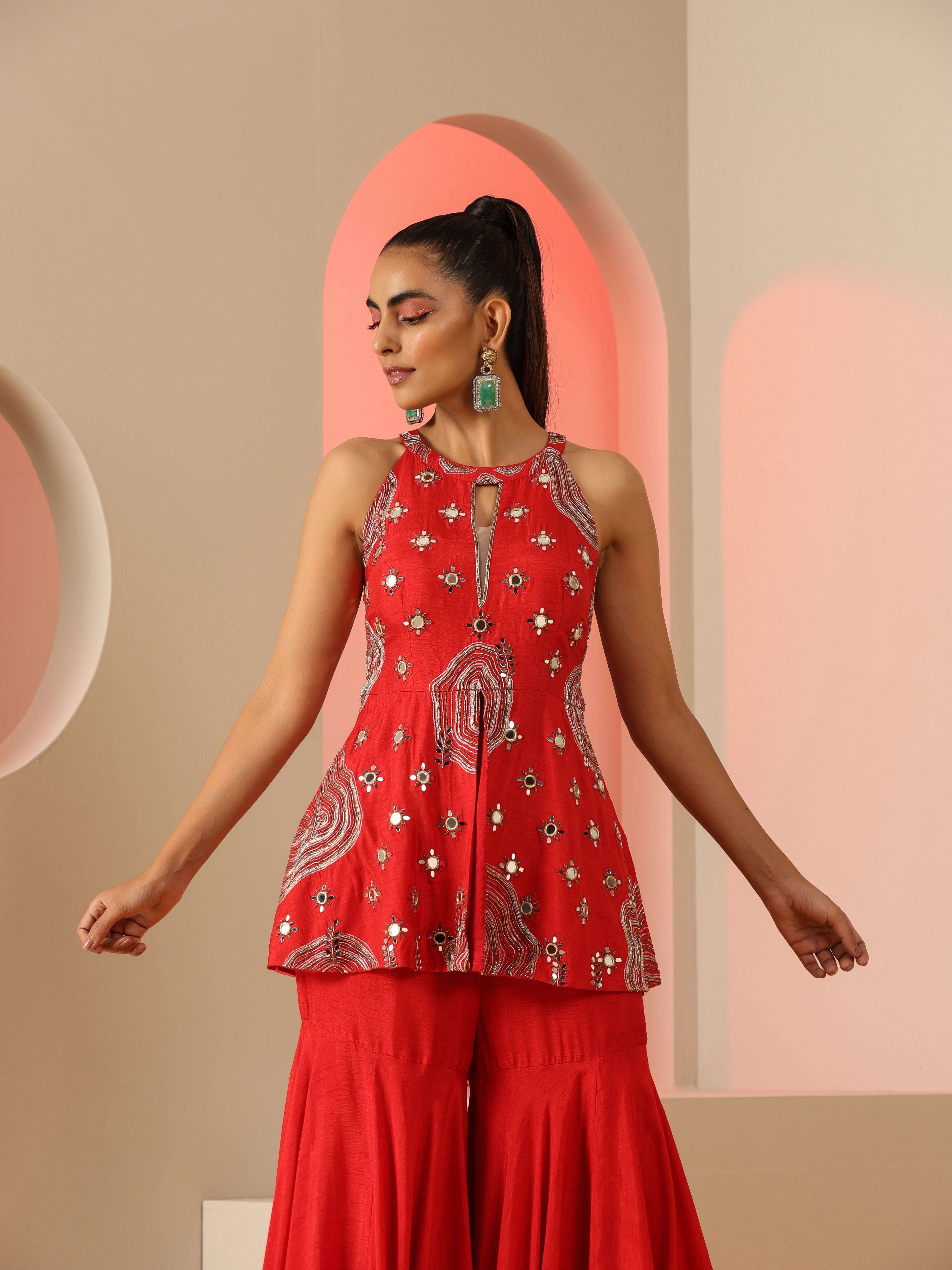 Red Zari and mirror work sharara set.